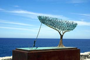 tree figure by sea